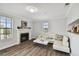 Spacious living room featuring a fireplace and comfy seating at 1000 W Horatio St # 312, Tampa, FL 33606