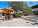 Outdoor patio seating area with tables and umbrellas at 1000 W Horatio St # 312, Tampa, FL 33606
