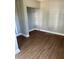 Bedroom with wood flooring and closet space at 3409 E 9Th Ave, Tampa, FL 33605