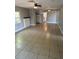 Bright living room with tile flooring, a decorative fireplace, and ample natural light at 3409 E 9Th Ave, Tampa, FL 33605