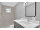 Clean bathroom, featuring gray vanity and tiled shower at 3206 N 29Th St, Tampa, FL 33605