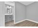 Bedroom with gray walls and view into bathroom at 3206 N 29Th St, Tampa, FL 33605