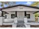 White house with black accents, front porch, and steps at 3206 N 29Th St, Tampa, FL 33605