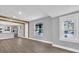 Open living area with gray walls and wood-look flooring at 3206 N 29Th St, Tampa, FL 33605
