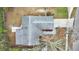 Aerial view of a single-Gathering home with gray roof and a spacious backyard at 6201 Cedarbrook N Dr, Pinellas Park, FL 33782