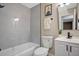 Clean bathroom with a bathtub, toilet and modern vanity at 6201 Cedarbrook N Dr, Pinellas Park, FL 33782
