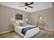 Bright bedroom with a comfortable bed and wood-look floors at 6201 Cedarbrook N Dr, Pinellas Park, FL 33782