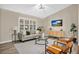 Modern living room with light walls, wood floors, and comfy seating at 6201 Cedarbrook N Dr, Pinellas Park, FL 33782