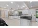 Modern kitchen with white cabinets and granite countertops at 1001 Edgemont Pl, Brandon, FL 33511