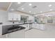 Modern kitchen with white cabinets and granite countertops at 1001 Edgemont Pl, Brandon, FL 33511