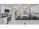 Modern kitchen with white cabinets and granite countertops at 1001 Edgemont Pl, Brandon, FL 33511