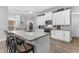 Modern kitchen with white cabinets and granite countertop at 3260 Wentworth St, North Port, FL 34288