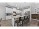 Modern kitchen with white cabinets and granite island at 3260 Wentworth St, North Port, FL 34288