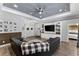 Living room with sectional sofa and view into bedroom at 3260 Wentworth St, North Port, FL 34288