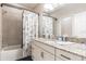 Clean bathroom with a shower/tub combo and granite countertop at 8726 Terracina Lake Dr, Tampa, FL 33625