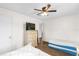 Bedroom with two twin beds, dresser and ceiling fan at 1621 S Jefferson Ave, Clearwater, FL 33756