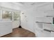 Bright laundry room with washer, dryer, and built-in shelving units at 1621 S Jefferson Ave, Clearwater, FL 33756