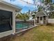 Inviting backyard with a pool, shed, and fenced area at 5339 Brookmeade Dr, Sarasota, FL 34232