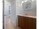 Bathroom with wood cabinets and a walk-in closet at 5339 Brookmeade Dr, Sarasota, FL 34232