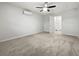 Bright bedroom featuring carpet flooring and a large closet at 5339 Brookmeade Dr, Sarasota, FL 34232
