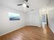 Bright bedroom featuring wood flooring and a large closet at 5339 Brookmeade Dr, Sarasota, FL 34232