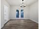 Dining room with French doors opening to the pool area at 5339 Brookmeade Dr, Sarasota, FL 34232
