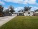 Updated single story home with a well-manicured lawn and driveway at 5339 Brookmeade Dr, Sarasota, FL 34232