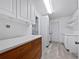 Laundry room with white cabinets and wood drawers at 5339 Brookmeade Dr, Sarasota, FL 34232