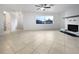 Spacious living area with tile floors and a fireplace at 5339 Brookmeade Dr, Sarasota, FL 34232