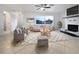 Bright living room featuring fireplace, tiled floors, and comfy seating at 5339 Brookmeade Dr, Sarasota, FL 34232