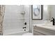 Bathroom with subway tile and quartz countertop at 14517 Coastal Woodland Ln, Parrish, FL 34219