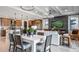 Open dining area with kitchen and Gathering room access at 14517 Coastal Woodland Ln, Parrish, FL 34219