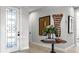Bright entry with decorative accents and view into bedroom at 14517 Coastal Woodland Ln, Parrish, FL 34219