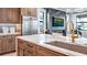 Modern kitchen with marble countertops, sink, and stainless steel appliances at 14517 Coastal Woodland Ln, Parrish, FL 34219