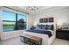 Spacious main bedroom with lake view and stylish furnishings at 14517 Coastal Woodland Ln, Parrish, FL 34219