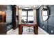 Home office with built-in shelves and large window at 14517 Coastal Woodland Ln, Parrish, FL 34219