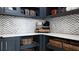Walk-in pantry with white quartz countertops and chevron backsplash at 14517 Coastal Woodland Ln, Parrish, FL 34219