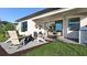 Outdoor patio with seating area, fire pit, and built-in grill at 14517 Coastal Woodland Ln, Parrish, FL 34219