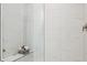 Walk-in shower with marble tile and built-in seat at 14517 Coastal Woodland Ln, Parrish, FL 34219