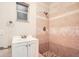 Updated bathroom with a shower and tiled walls at 11606 Nature Trl, Port Richey, FL 34668