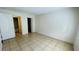 Bedroom with tile floors and access to bathroom and closet at 5504 Pokeweed Ct # 154, Tampa, FL 33617