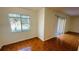 Bright bedroom with window, tile floors, and access to patio at 5504 Pokeweed Ct # 154, Tampa, FL 33617