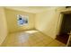 Bright bedroom with tile floors and window at 5504 Pokeweed Ct # 154, Tampa, FL 33617