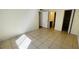 Bedroom with tile floors and access to bathroom and closet at 5504 Pokeweed Ct # 154, Tampa, FL 33617