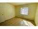 Simple bedroom with tile floor and window with blinds at 5504 Pokeweed Ct # 154, Tampa, FL 33617