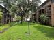 Landscaped walkway with lush greenery and outdoor lighting in a community at 5504 Pokeweed Ct # 154, Tampa, FL 33617