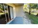 Small patio overlooking a peaceful pond at 5504 Pokeweed Ct # 154, Tampa, FL 33617