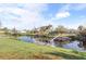 Private dock on a calm canal with a view of neighboring homes at 6540 Marius Rd, North Port, FL 34287