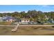 Bird's eye view of waterfront home with private pool and dock at 103 Shore Dr, Dunedin, FL 34698