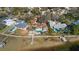 Aerial view of house, pool, and dock on waterfront property at 103 Shore Dr, Dunedin, FL 34698